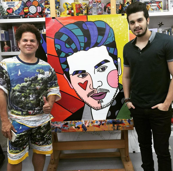 Luan Santana recebe quadro de Romero Britto. Foto: Reprodução/Instagram