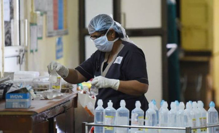 O causador da gripe espanhola foi o vírus da influenza A, ou H1N1, o mesmo que causou a pandemia de 'gripe suína' de 2009, que matou mais de 18 mil pessoas. Foto: Sam Panthaky/AFP/Foto: Sam Panthaky/AFP O causador da gripe espanhola foi o vírus da influenza A, ou H1N1, o mesmo que causou a pandemia de 'gripe suína' de 2009, que matou mais de 18 mil pessoas. Foto: Sam Panthaky/AFP/Foto: Sam Panthaky/AFP