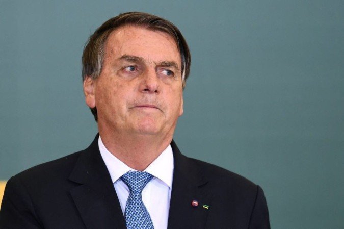 O comprovante de vacinação completo é obrigatório para acessar ao estádio; presidente está passando o final de semana no Guarujá, litoral paulista./Evaristo Sa/AFP