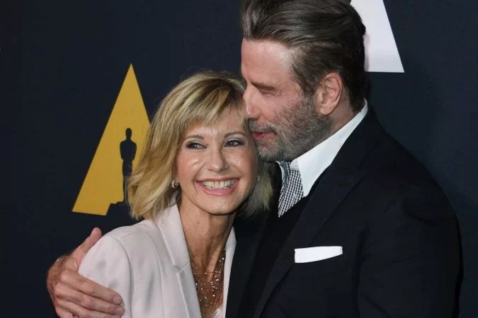 /John interpretou Danny, par romântico de Olivia no longa musical de sucesso Grease, lançado em 1978. Foto: Mark RALSTON / AFP