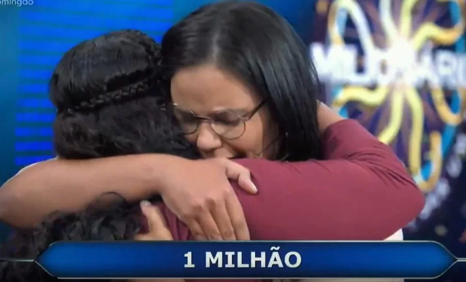 Julie Dutra, a vencedora do programa 'Quem quer ser o milionário'  é orfã e mãe/Crédito: Reprodução / TV Globo