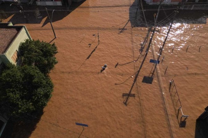 Vista aérea de ruas inundadas no bairro de São João, em Porto Alegre/foto: Florian Plaucheur/AFP Vista aérea de ruas inundadas no bairro de São João, em Porto Alegre/foto: Florian Plaucheur/AFP