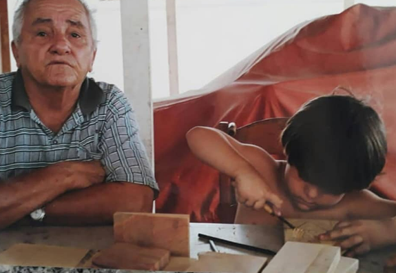J. Borges e o filho Bacaro quando criança