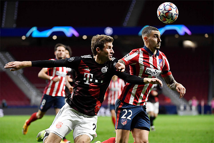 Thomas Müller, de pênalti, fez o gol de empate do Bayern: resultado adiou classificação dos espanhóis